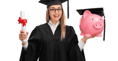 Happy graduate student holding a diploma and a piggybank isolated on white background