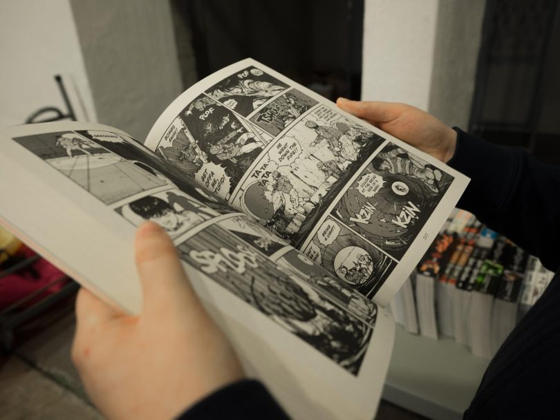 student reading comic book