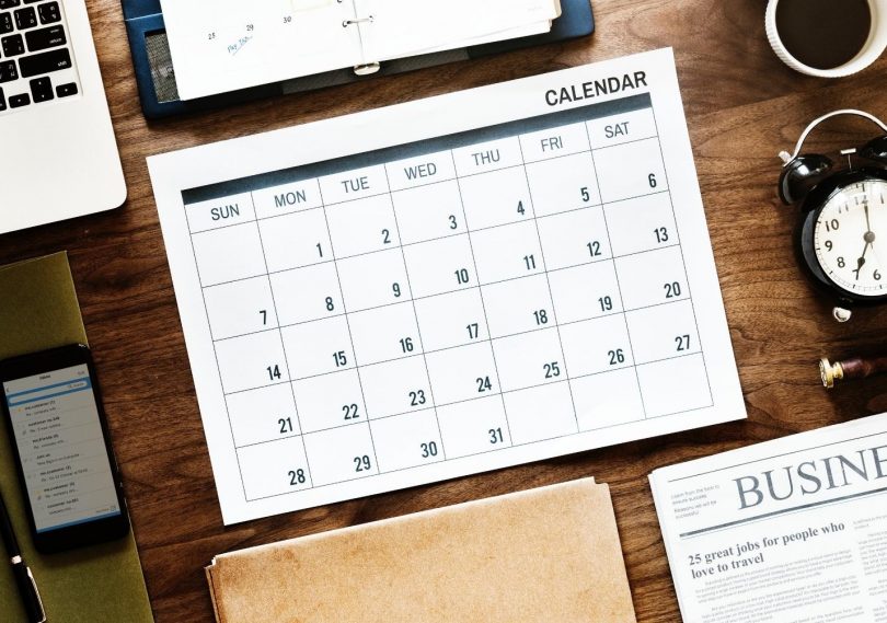 student calendar sitting on a wooden desk