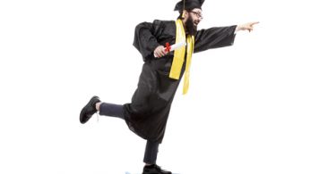 bearded male graduate riding a skateboard, pointing forward and holding diploma on white background