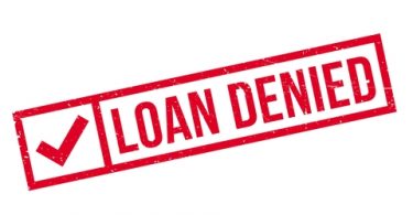 the words loan denied in red with a check mark